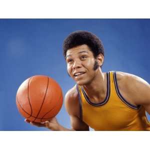  African American Man in Basketball Top Holding Ball 