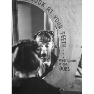 Girl Checking Teeth for Signs of Decay at the Dallas Health Museum 