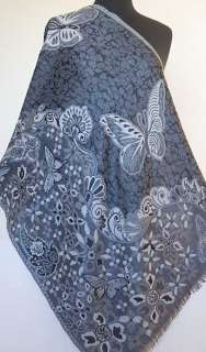 motif of butterflies gives this shawl a light hearted attitude.