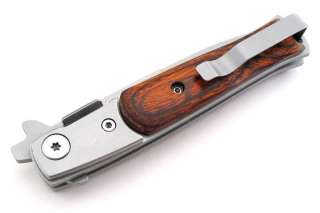   brown wood onlay handles. Stainless pocket clip. Brand new in box