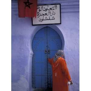  Woman Exits thru Moorish Style Blue Door, Morocco 