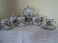 TRISA FINE PORCELAIN CUPID 17 PC. CHOCOLATE SET  