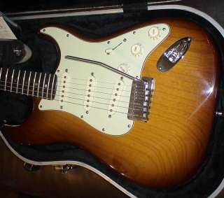   bar, Fender polish kit, a set of new ernie ball 9 gauge strings, and