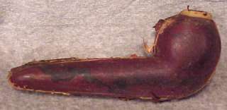   Briar pipe. It is a brown leather covered wood case with gray velvet