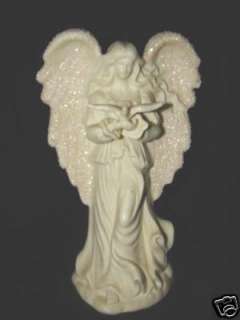 This is a Beautiful PORCELAIN ANGEL WITH GLITTER & BIRD. It measures 